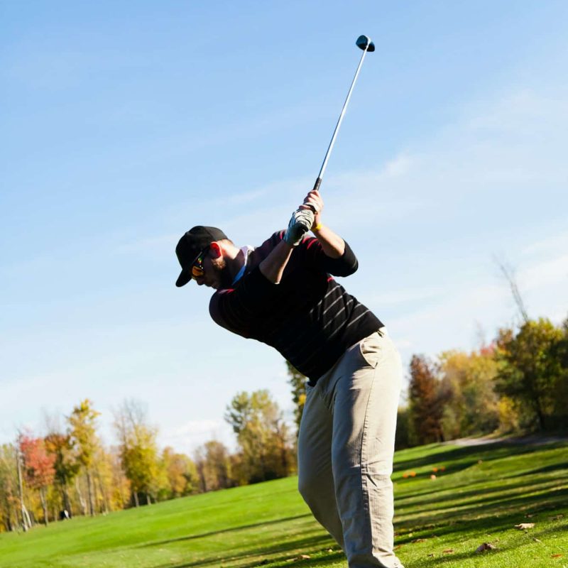 Man playing golf